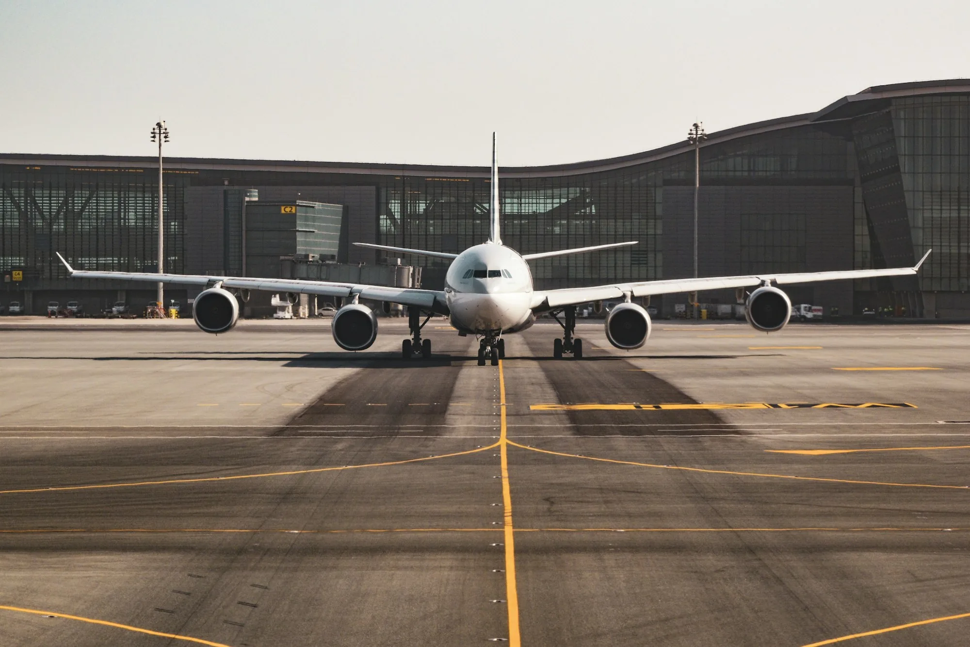 Wide-body aircraft on the tarmac at golden hour